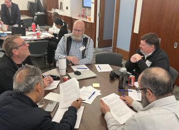 Exercise participants engaged in discussion during the TTX.
