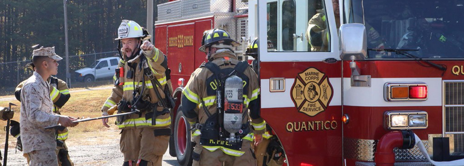 Firefighters outside truck