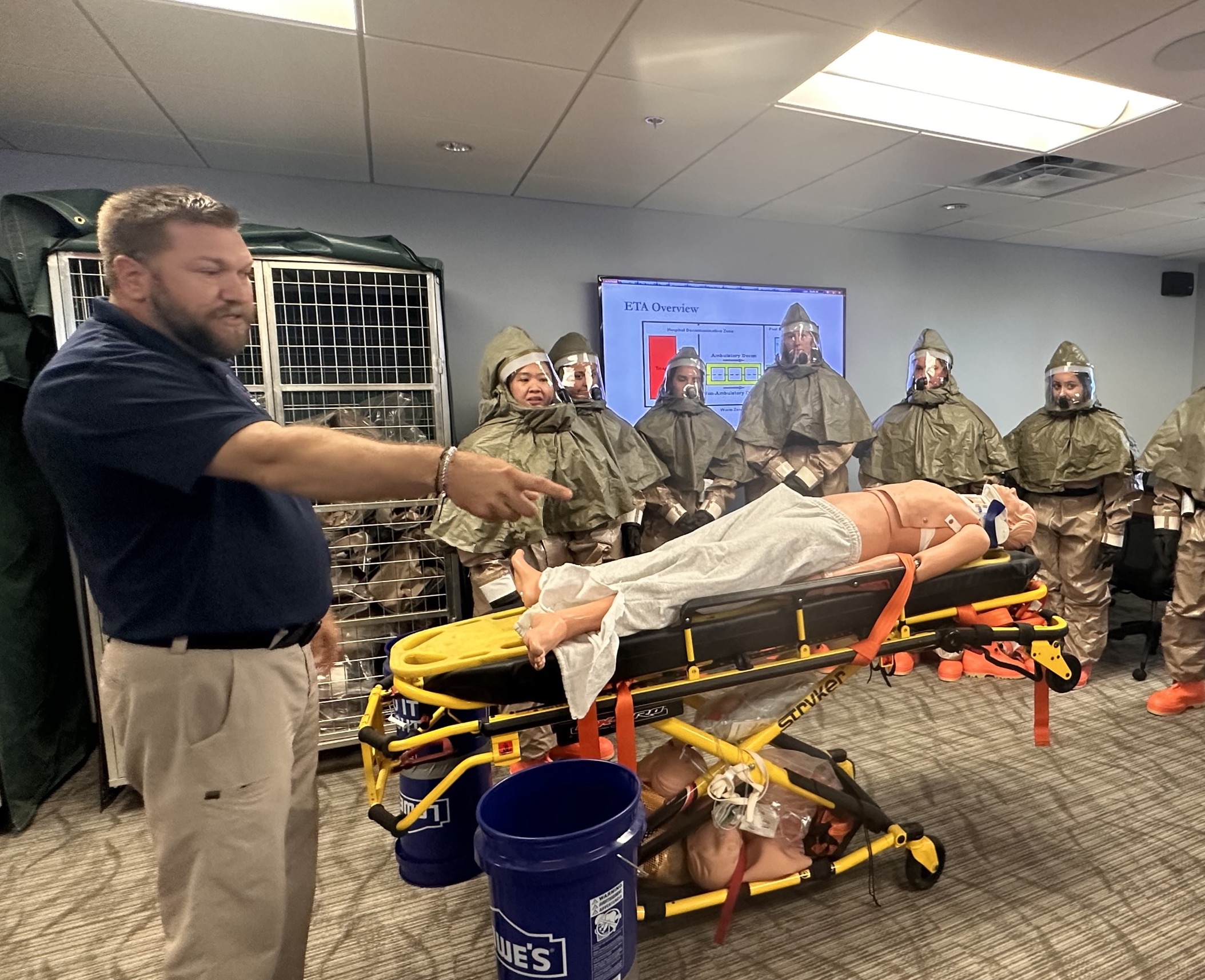 Instructor provides guidance on completing decontamination procedures. 