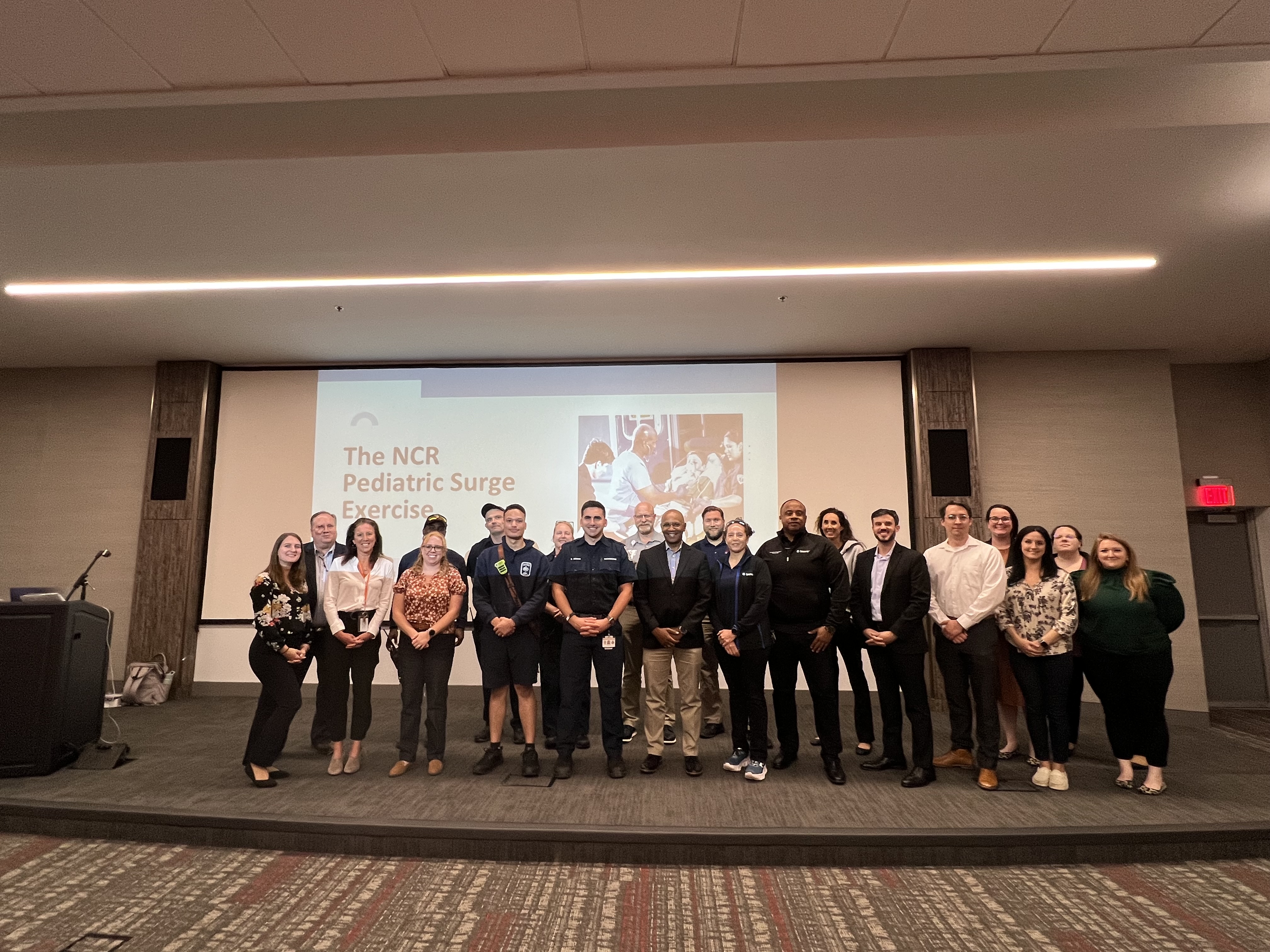 Pediatric Surge TTX participants pose for a photo following completion of the exercise.